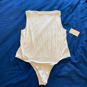 A new day woman’s compression bodysuit. NWT L